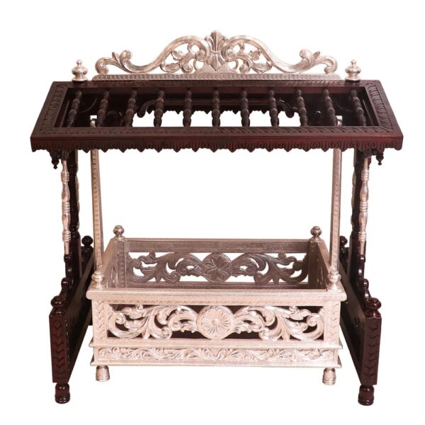 Side view of handcrafted teak baby cradle in antique white finish